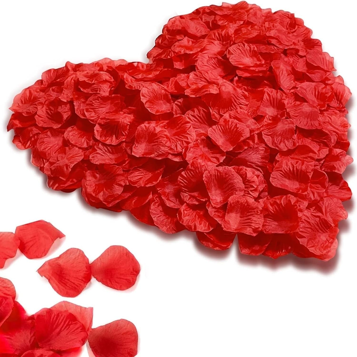 GoHooked red artificial rose petals arranged in a heart shape, with scattered petals on the side.