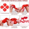 Go Hooked red artificial rose petals being separated for romantic decoration. Includes 50 tealight candles.
