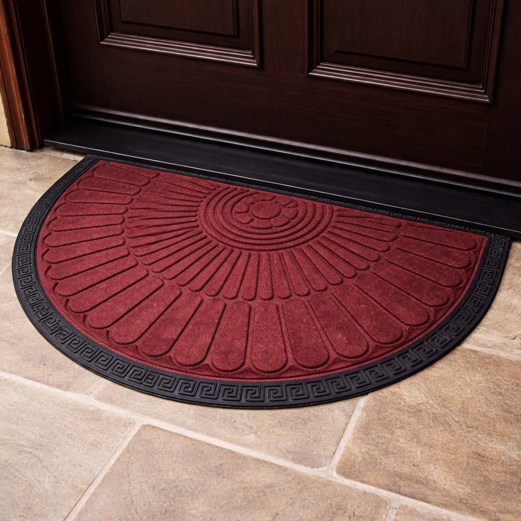GoHooked red semi-circle rubber door mat with a black border and sunburst pattern on a tiled floor.