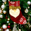 Go Hooked red Santa Claus Christmas stocking with white snowflake pattern and faux fur trim, festive holiday decor.
