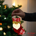 Go Hooked red Santa Claus Christmas stocking ornament with white snowflake pattern and glitter trim.