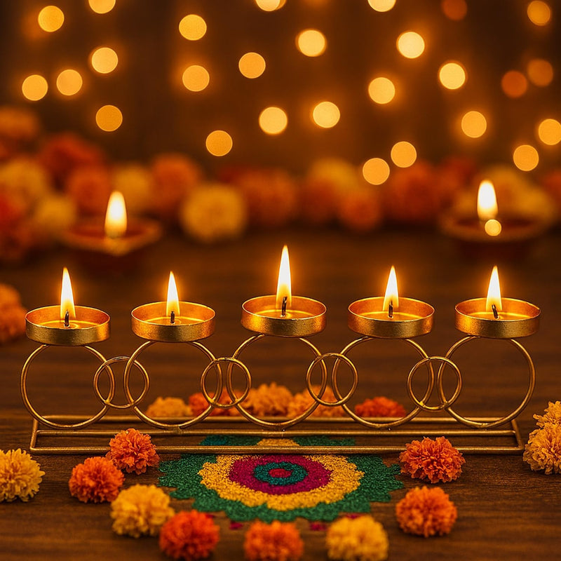 GoHooked RingLine tealight holder in matte gold finish with 5 cups, decorated with marigolds and rangoli for Diwali.