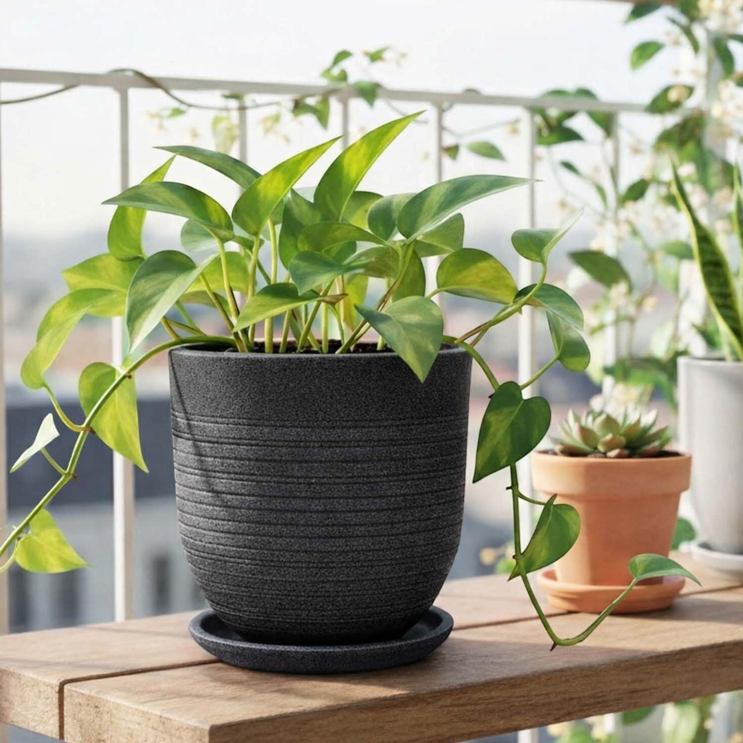 GoHooked Ripper 10 inch round polymer planter pot with textured ribbed design and matching saucer, in charcoal grey.