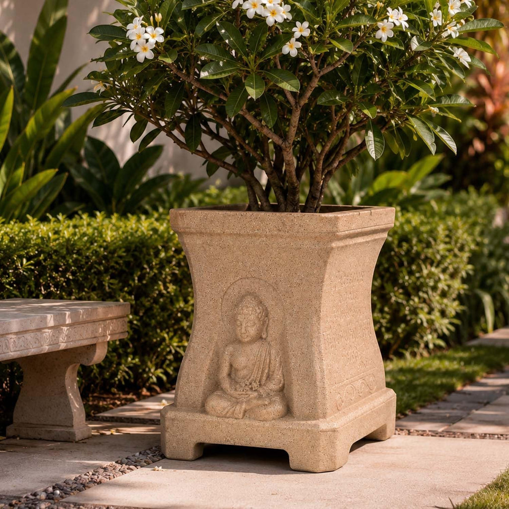 GoHooked sandstone square planter with a serene Buddha relief and engraved side quotes, holding a flowering plant.