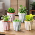 GoHooked assorted geometric plastic self-watering plant pots with inner drainage inserts, 4-inch size, set of 5.