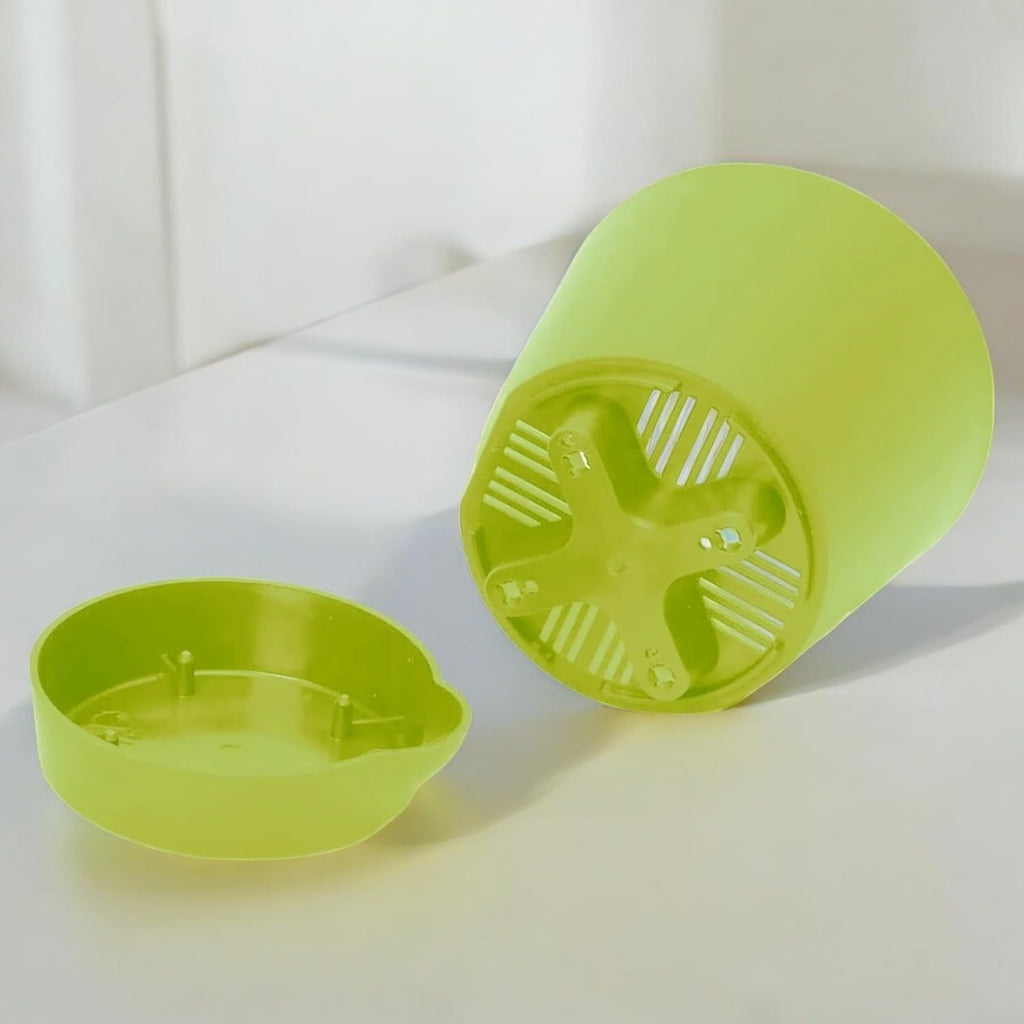 GoHooked 4-inch light green plastic self-watering planter pot with drainage and water reservoir.