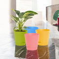 GoHooked 4-inch self-watering planter pots in green, pink, blue, and yellow. Premium plastic with UV protection.