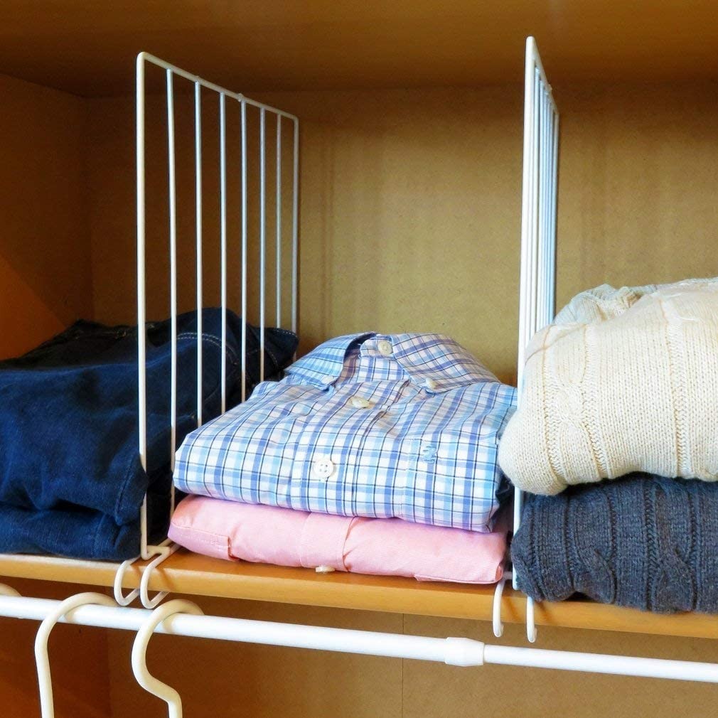 GoHooked white metal wire shelf dividers organize folded clothes and sweaters in a closet. Set of 2.
