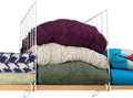 GoHooked white coated iron shelf dividers neatly stack sweaters, blankets, and towels on a wooden shelf.