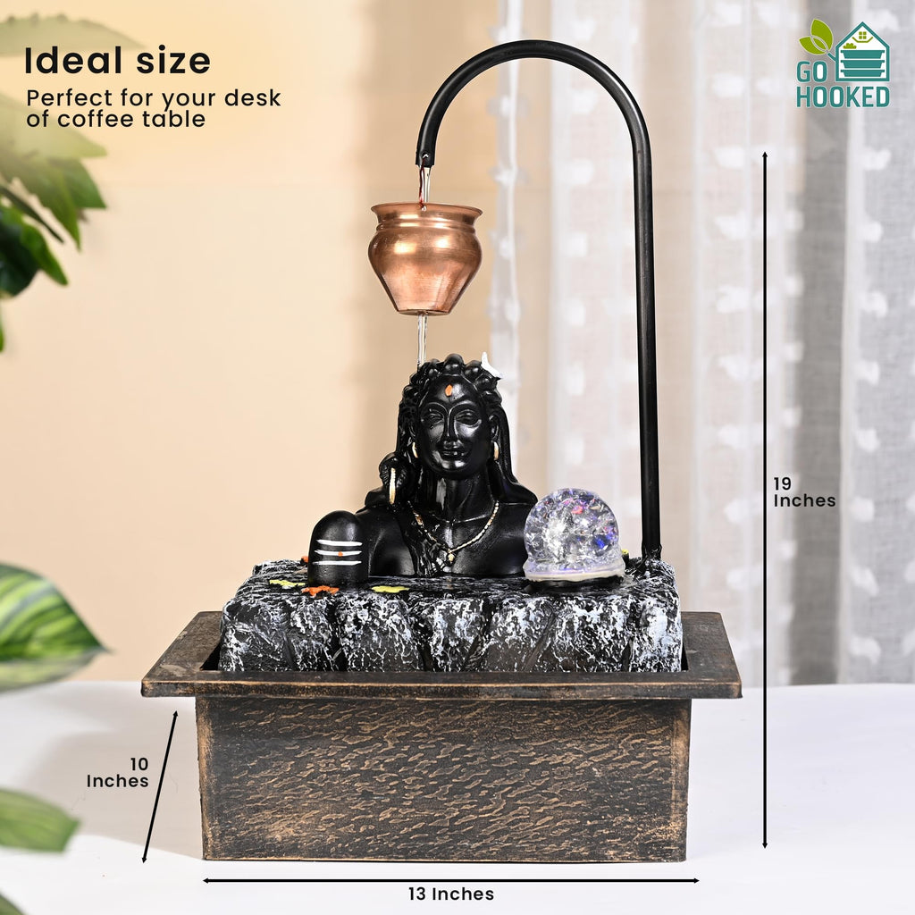 GoHooked matte black polyresin table fountain with Lord Shiva bust, LED crystal ball, and copper pot. 19 inches tall.