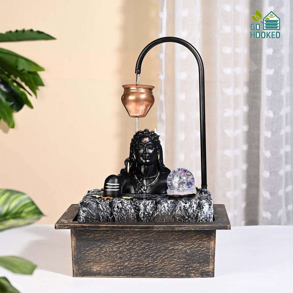 GoHooked matte black polyresin Lord Shiva fountain with copper kalash, LED crystal ball, and water flow. Indoor decor.