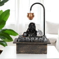 GoHooked matte black polyresin Lord Shiva fountain with copper kalash, LED crystal ball, and waterfall feature.