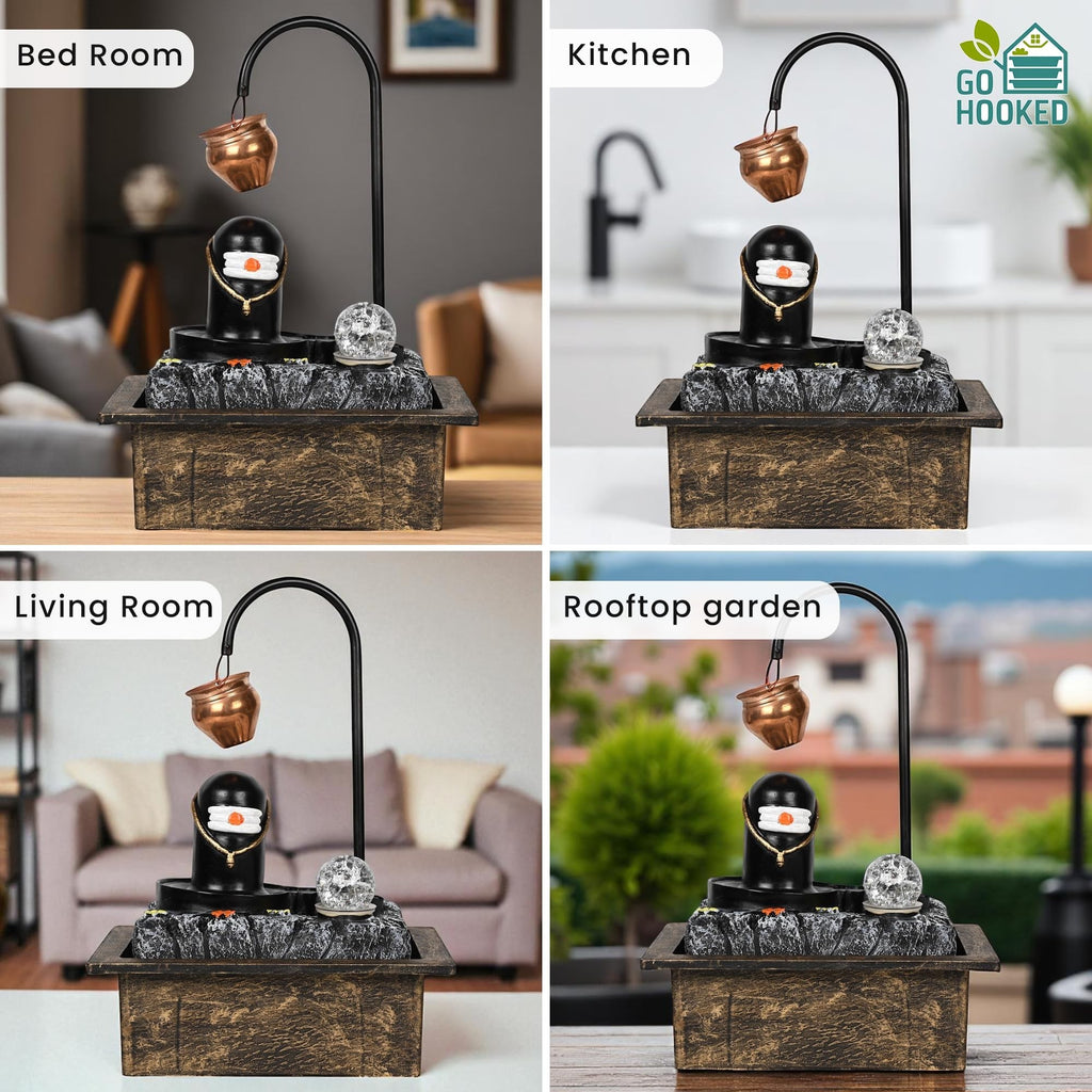 Go Hooked Shivling water fountain with copper kalash drip, LED crystal ball, and matte black polyresin base. Ideal for home decor, meditation.