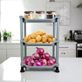 Go Hooked silver 3-tier storage rack with potatoes, onions, and jars of food items.