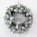 GoHooked silver Christmas wreath with poinsettias, glitter accents, and "Christmas Greetings" text. Festive home decor.