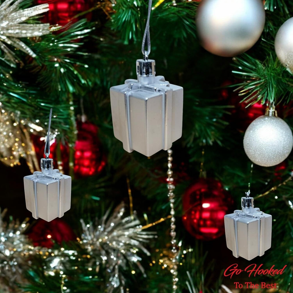 Go Hooked silver gift box Christmas ornaments with glitter accents, perfect for festive decor.