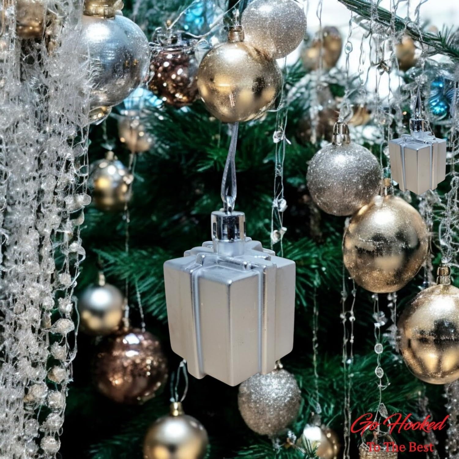 GoHooked silver gift box Christmas ornaments with glitter accents, part of a festive tree decor set.