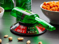 GoHooked Spin the Bottle drinking game with green spinner and party challenges like Take a Shot. Plastic game.