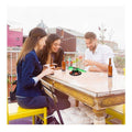 Go Hooked Spin the Bottle drinking game with green spinner on a table with friends playing. Fun party game for adults.