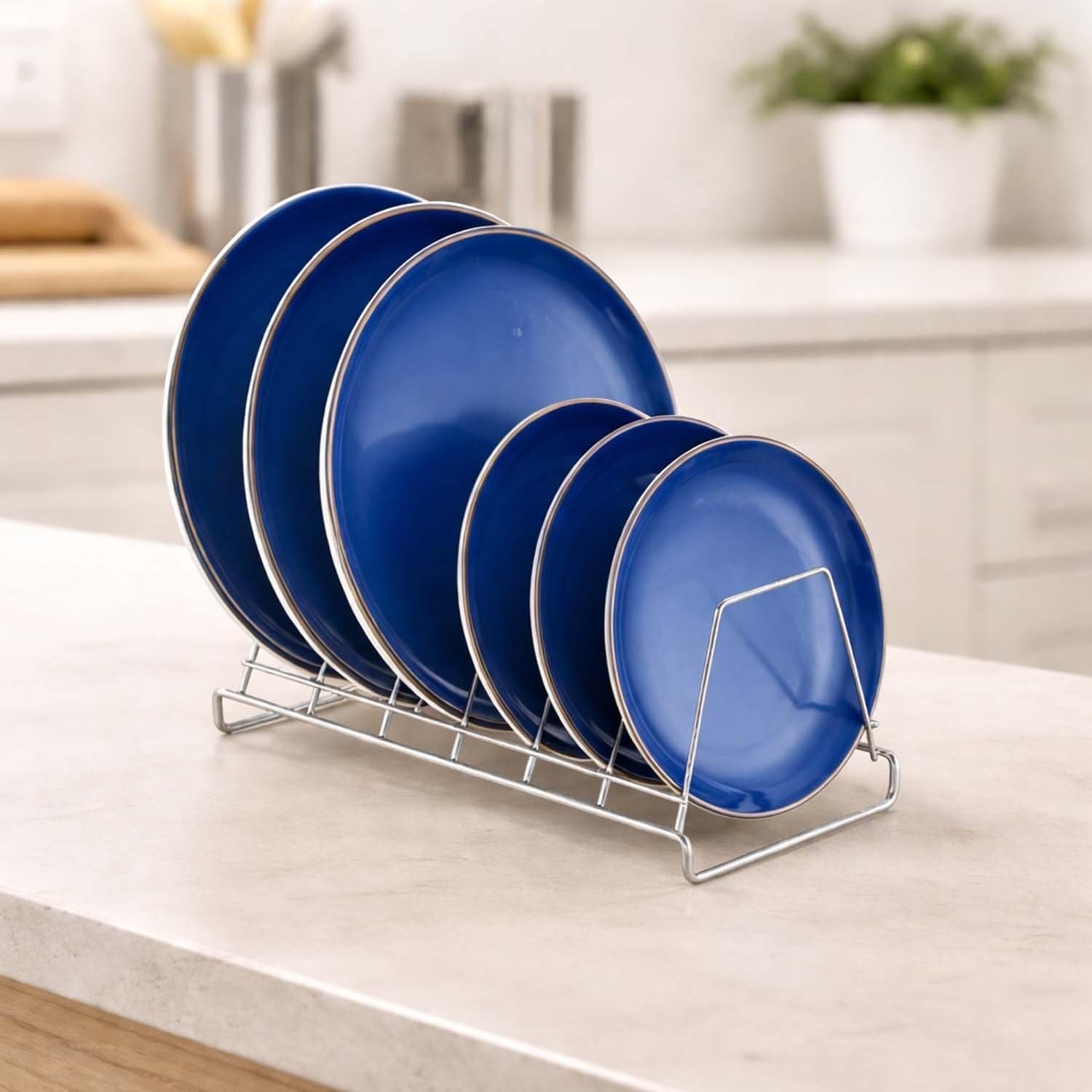 Go Hooked stainless steel 6-slot plate rack organizer holding blue plates on a countertop.