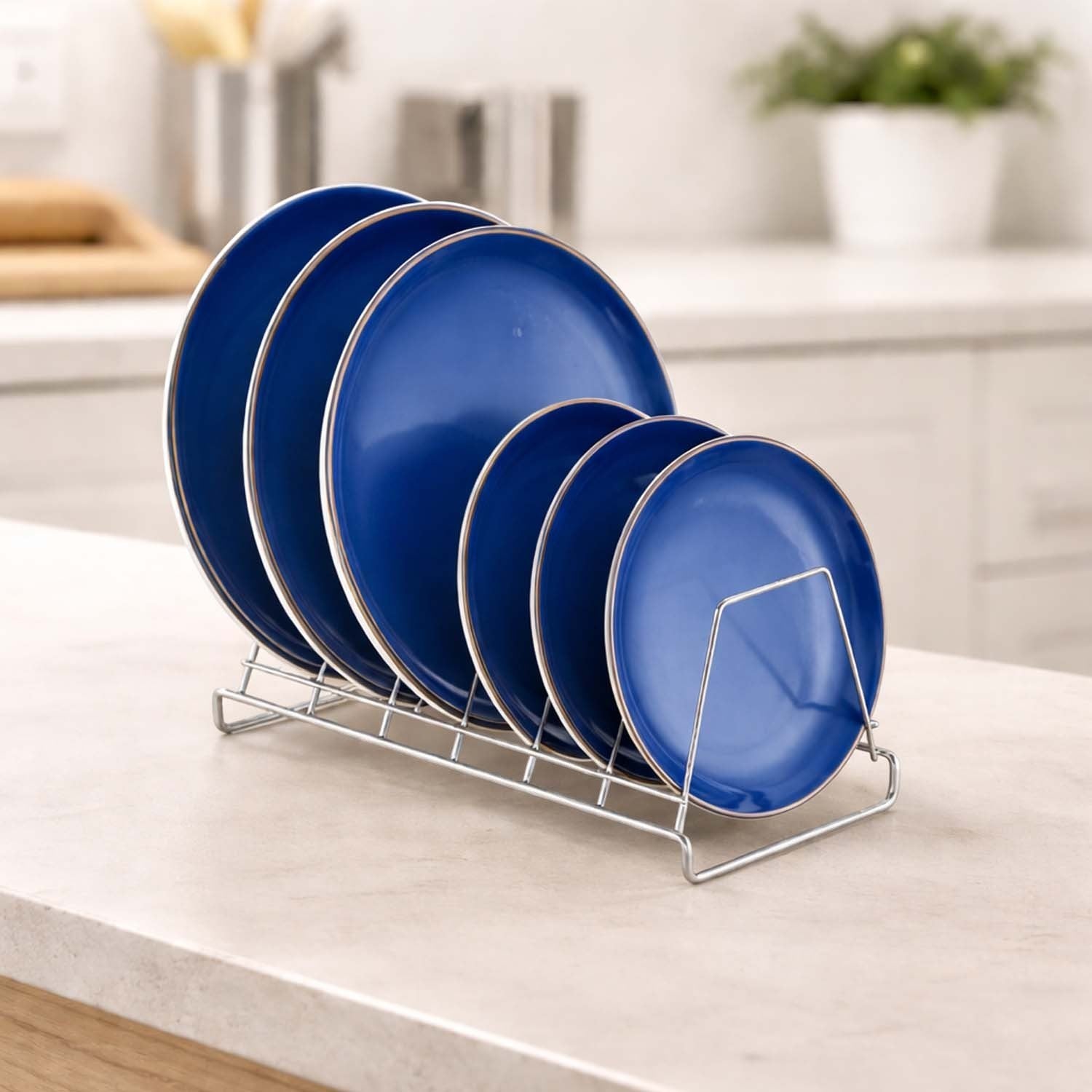 GoHooked stainless steel plate rack holding blue dinner plates on a kitchen countertop