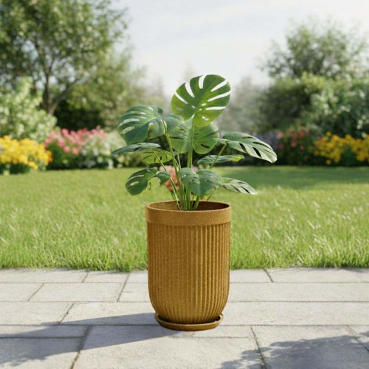 GoHooked 24-inch tall brown sandstone planter with vertical ribbed texture and gold accent, outdoors on a patio.