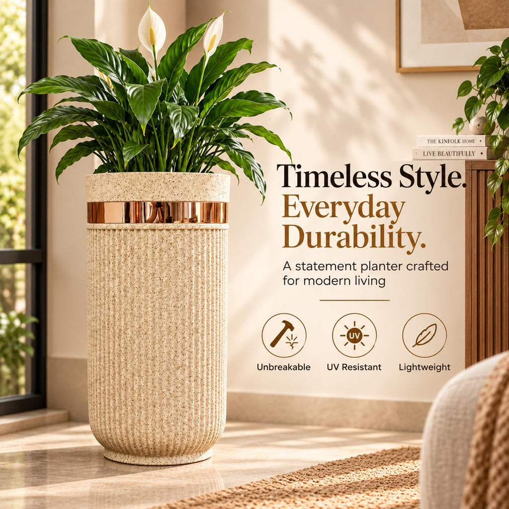 GoHooked 24-inch tall round sandstone planter with ribbed texture and a metallic gold accent band holding a green plant.