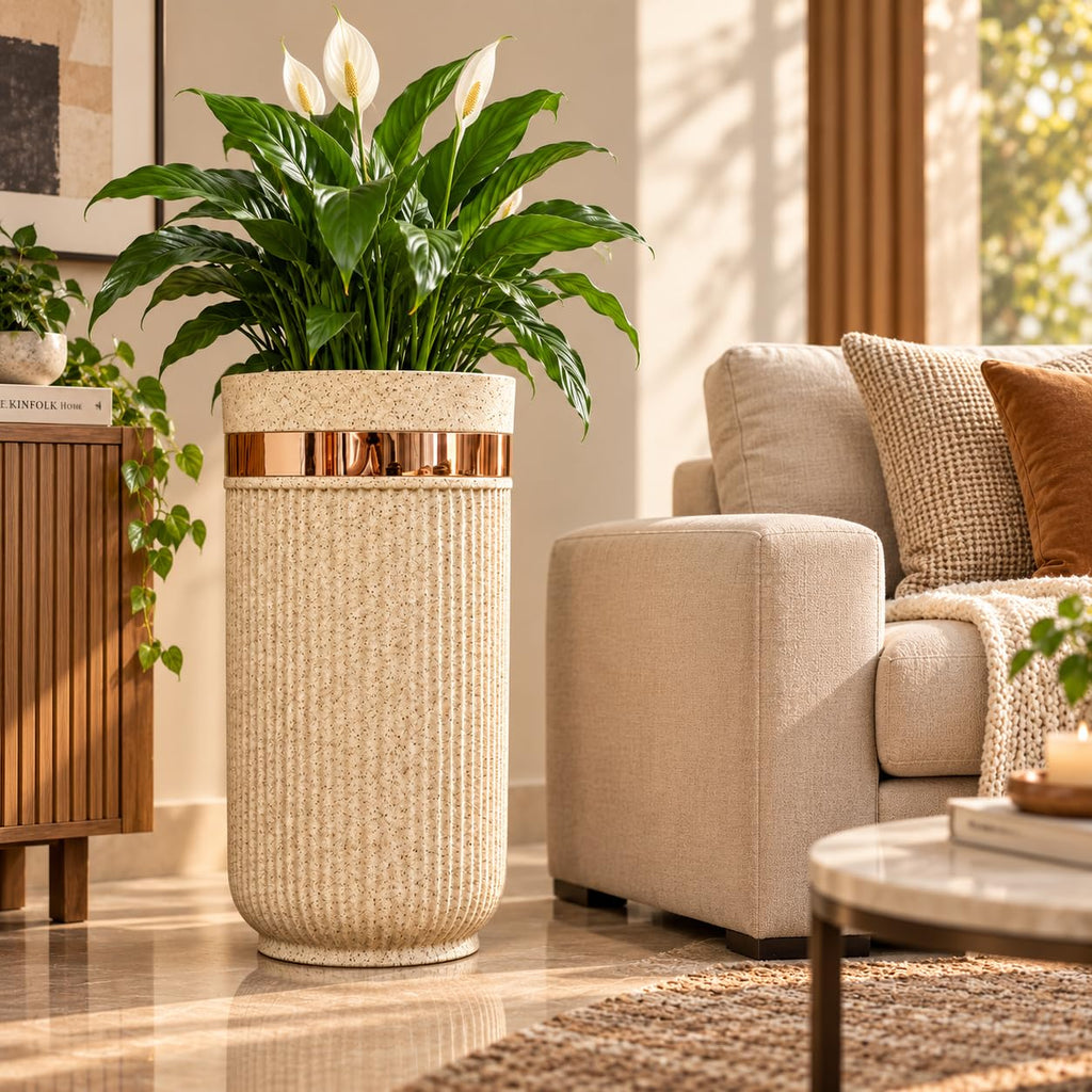 GoHooked 24-inch tall brown sandstone planter with vertical ribbed texture and a metallic gold accent band in a living room
