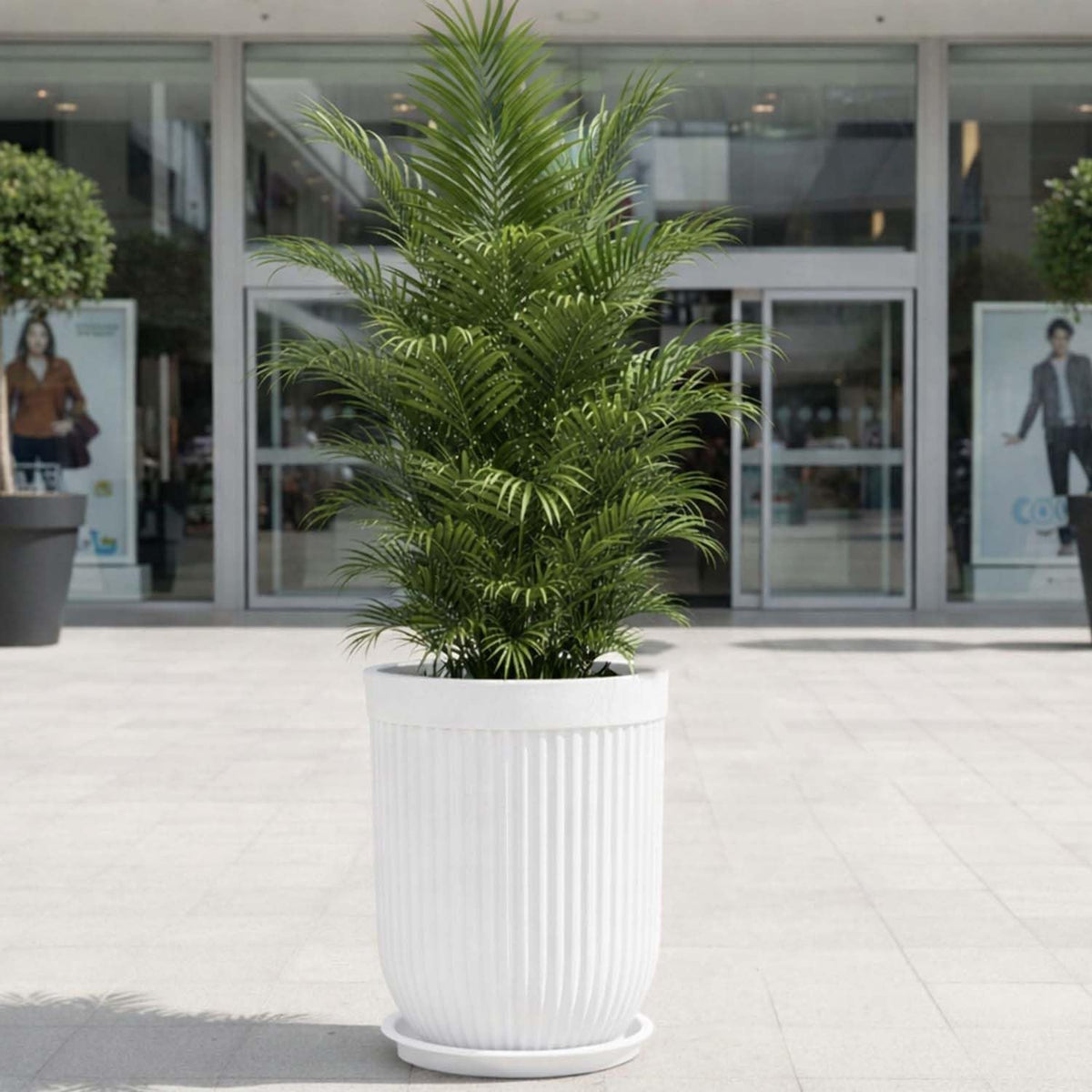GoHooked 24-inch tall white ribbed floor planter with a plant, featuring a modern design for indoor or outdoor use.