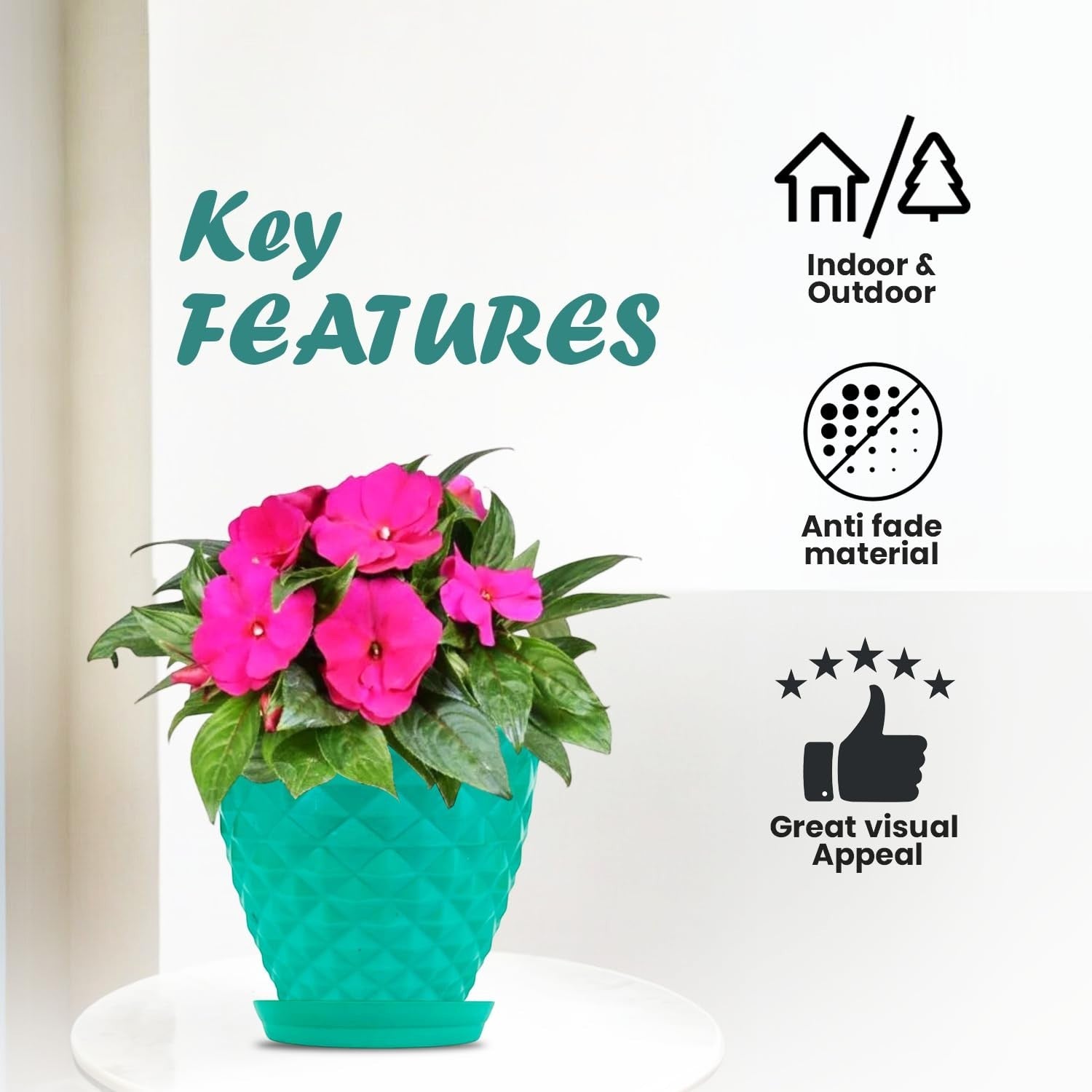 GoHooked teal diamond-patterned plastic planter pot with pink flowers and saucer, suitable for indoor/outdoor use.