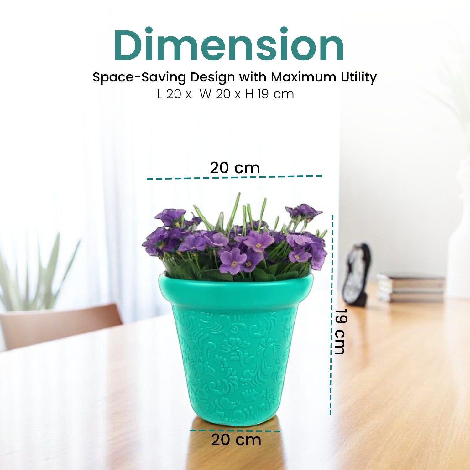 GoHooked 8-inch teal plastic planter pot with embossed floral pattern and purple flowers on a wooden table