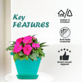 GoHooked teal plastic planter pot with pink flowers, includes saucer tray. Suitable for indoor/outdoor use.