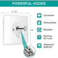 GoHooked transparent adhesive wall hooks, 6cm square, heavy-duty, waterproof, nail-free, ideal for keys, bathrooms, and photo frames.