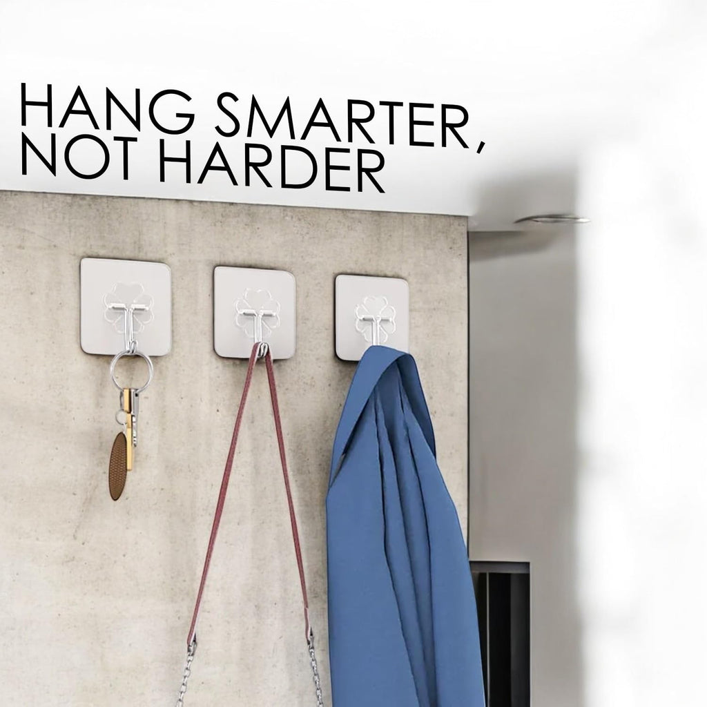 GoHooked transparent flower-shaped adhesive hooks holding keys, a bag, and a blue jacket. Heavy-duty, no-drill.