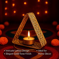 GoHooked triangular metal tealight holder with floral cutwork in matte gold finish, holding a lit tealight.
