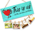 GoHooked turquoise wood sign with "This is Us" quote and red heart, holding family photos with clips.
