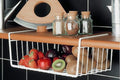 GoHooked white powder coated iron under shelf basket holding strawberries, apples, plums, and kiwis.
