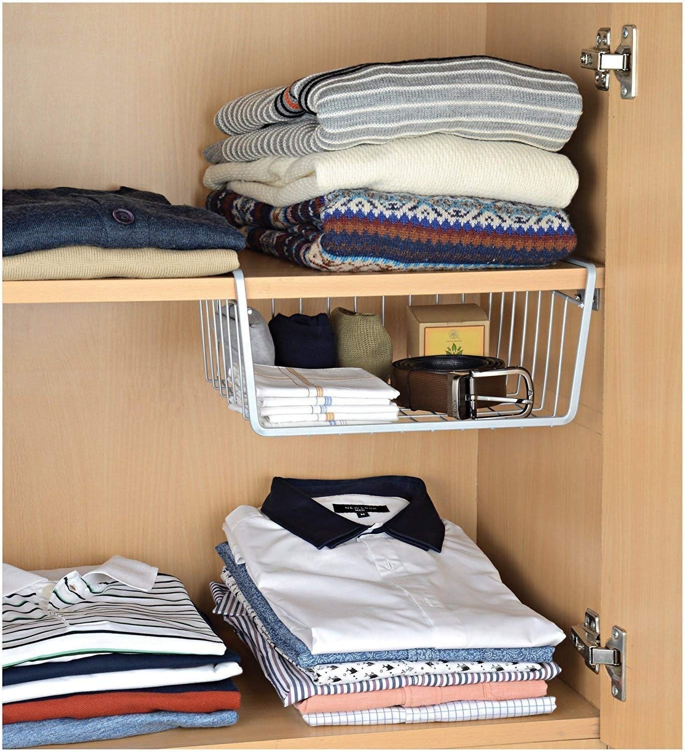 Go Hooked white metal undershelf basket holding folded clothes, socks, and a belt. Set of 2.