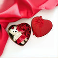 GoHooked white teddy bear with red dress and I Love You tag in heart-shaped tin box with red roses.
