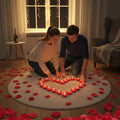 Go Hooked Valentine's Day decor set with a couple arranging heart-shaped red candles and rose petals for a romantic ambiance.