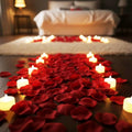 Go Hooked Valentine's Day decor set with 12 LED candles and 1500 red artificial rose petals scattered on the floor and rug.