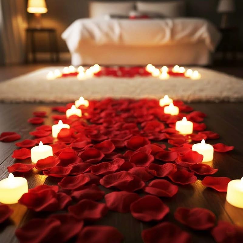 Go Hooked Valentine's Day decor set with 12 LED candles and 1500 red artificial rose petals scattered on the floor and rug.