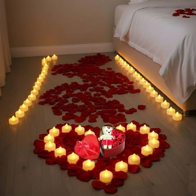GoHooked Valentine's Day decor set with red rose petals, LED tea lights, and a teddy bear in a heart-shaped box.