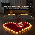 GoHooked Valentine's Day decor set with LED tea lights, rose petals, and teddy bear in heart-shaped box.