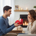 GoHooked Valentine's Day gift set with a teddy bear, red roses, and a card in a heart-shaped box, presented to a surprised woman.
