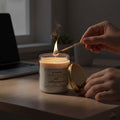 GoHooked ViMe white glass jar candle with jasmine scent, lit by a match. Perfect for home decor and aromatherapy.