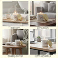 GoHooked ViMe white glass jar candle with gold lid, Lasting Lily scent, for home decor, relaxation, and aromatherapy.
