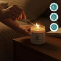 GoHooked ViMe white round aroma candle in a glass jar with bamboo & white tea scent, lit by a match.