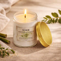 ViMe Bamboo & White Tea scented candle in a clear glass jar with a gold lid. Hand-poured wax.