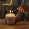 ViMe Blueberry scented aroma candle in a glass jar, lit with a match. Perfect for home decor and relaxation.